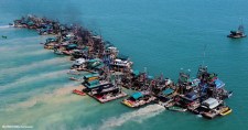 Wooden pontoons dredge the seabed for deposits of tin ore off the coast of Toboali, on the southern shores of the island of Bangka, Indonesia, 1 May 2021.